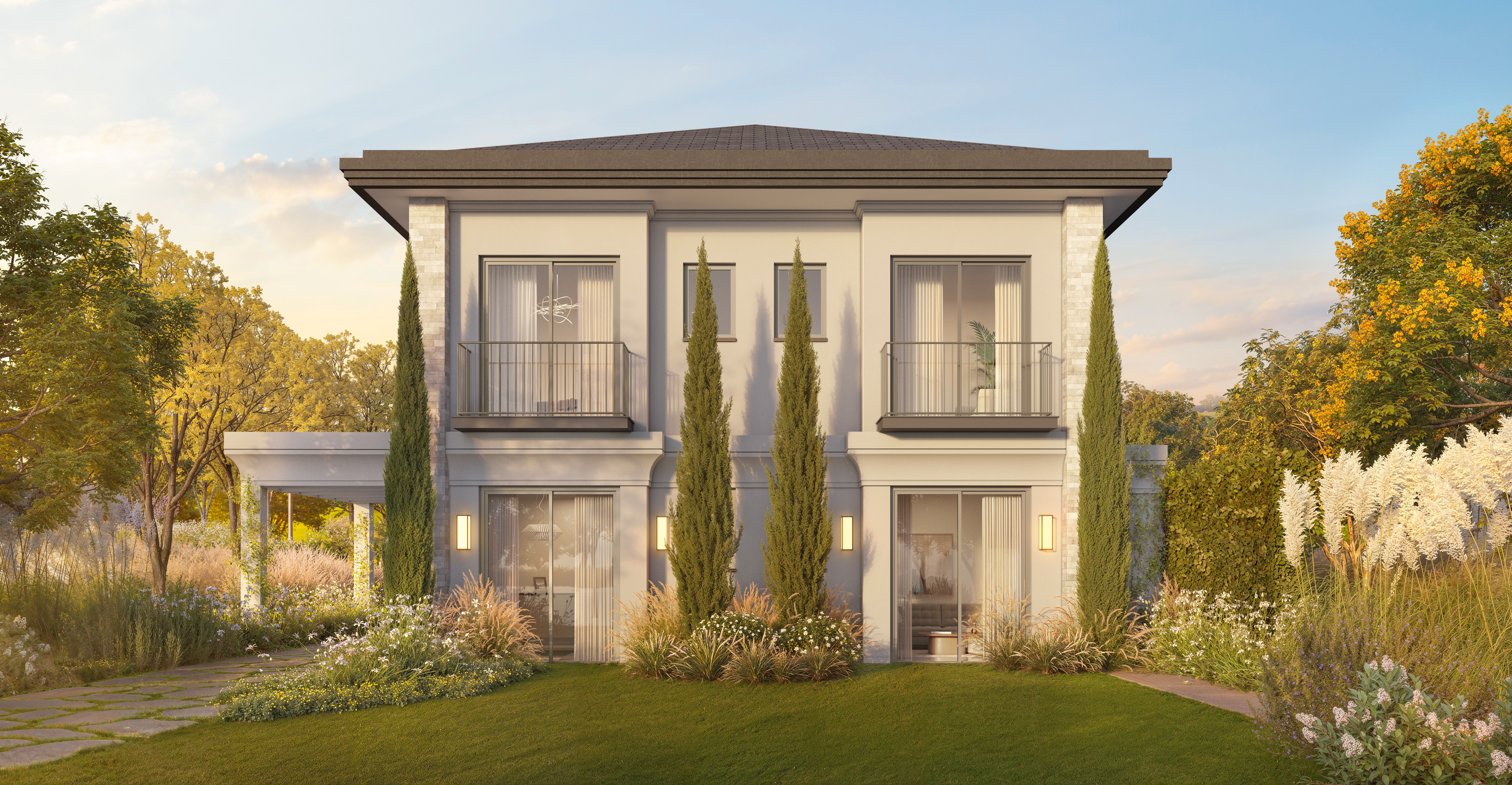 Residência Heritage Riviera — fachada com jardim ao pôr do sol